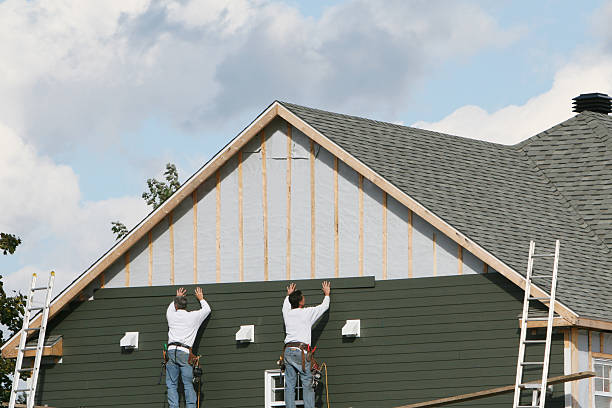 Professional Siding Replacement technician working in Fayville, MA